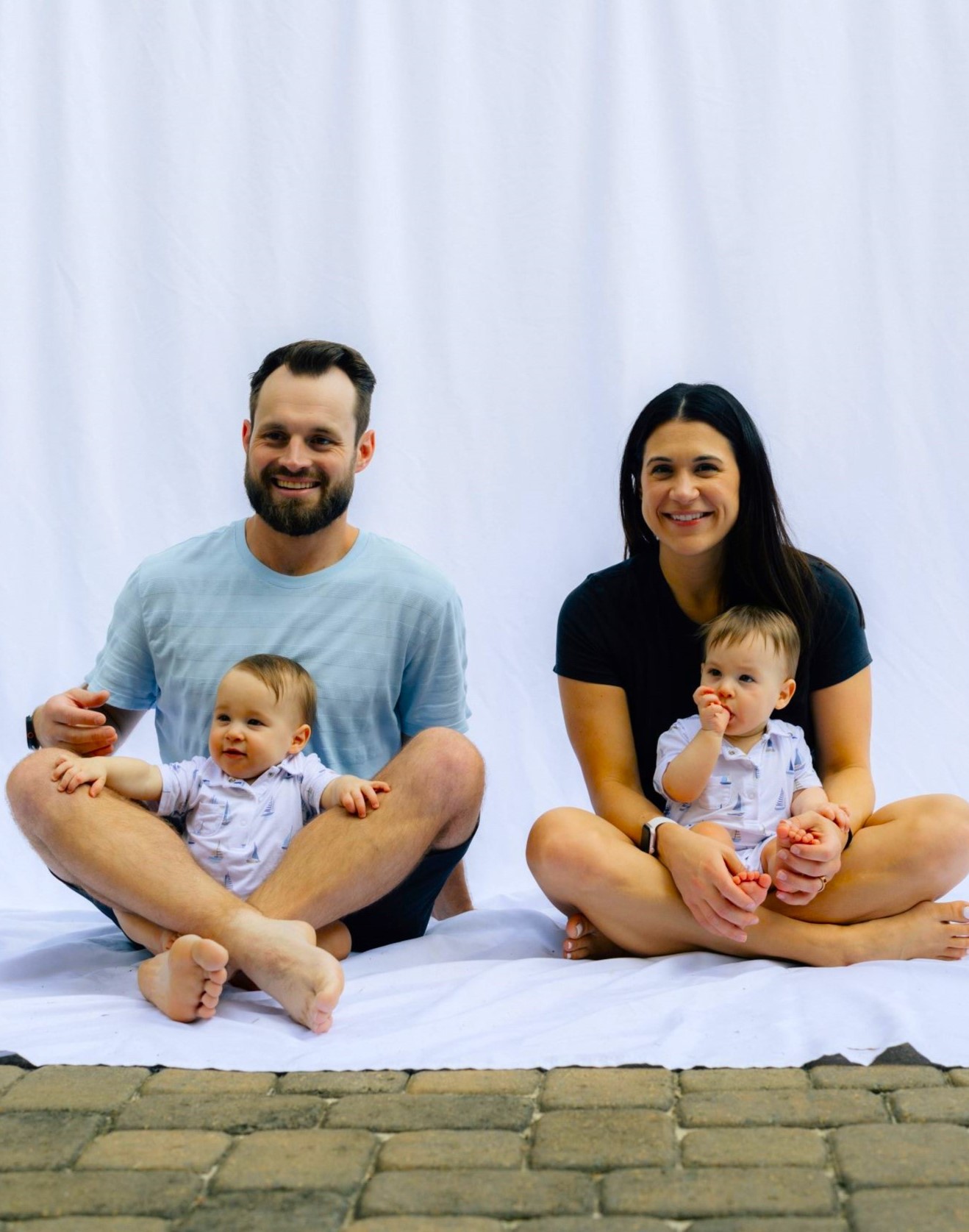 Parents sharing calm family time supporting children while all Addressing Challenging Child Behavior.