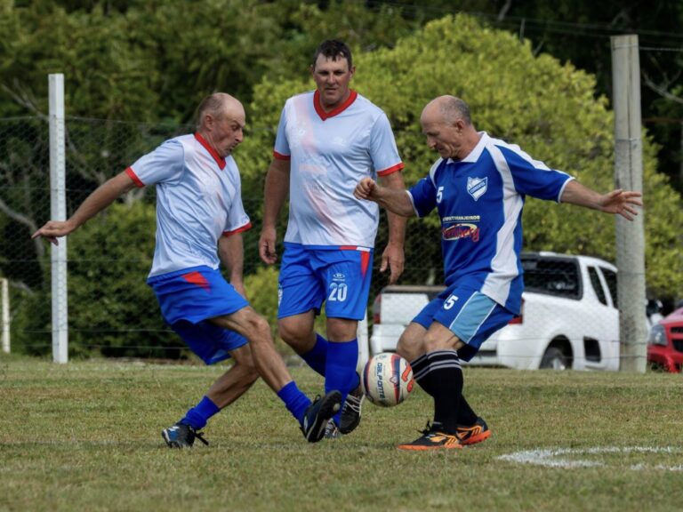 Men playing football, showing strength, mobility and healthy ageing reflecting pelvic health after Male Pelvic Conditioning.