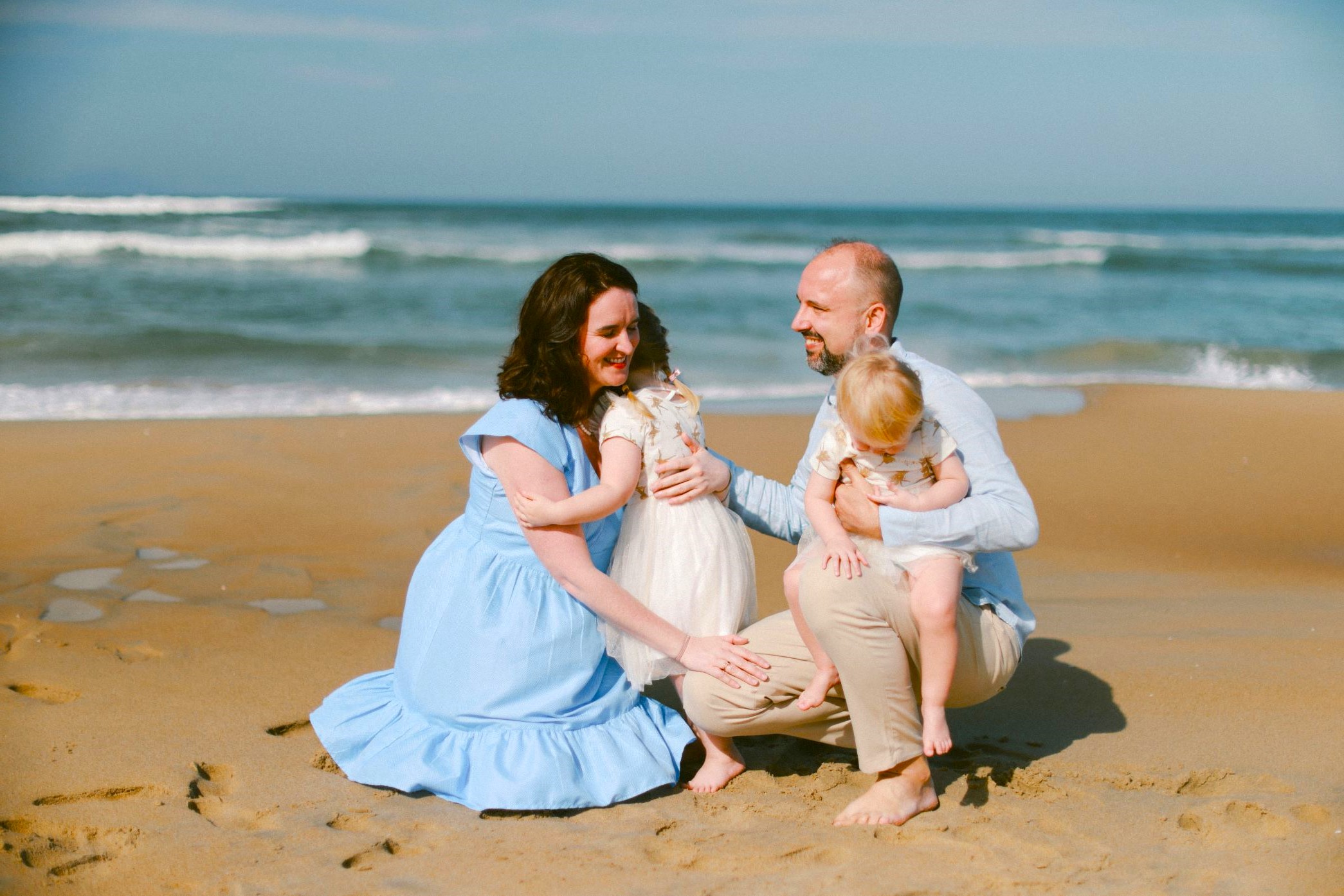 Parent comforting a young child after a death in the family, showing emotional safety and gentle support through Family Loss Support.