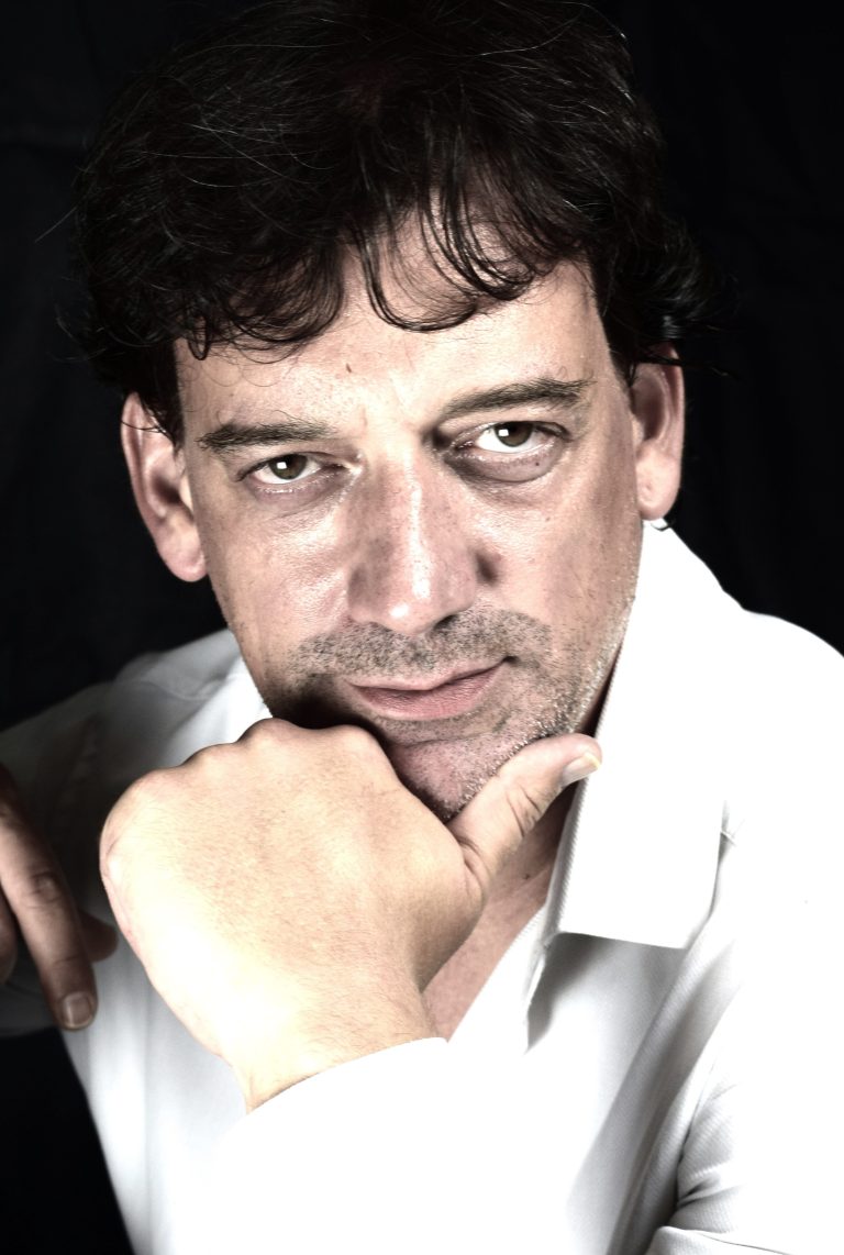Confident man in white shirt posing with direct gaze, symbolising strength and self-belief with Trust at the end.