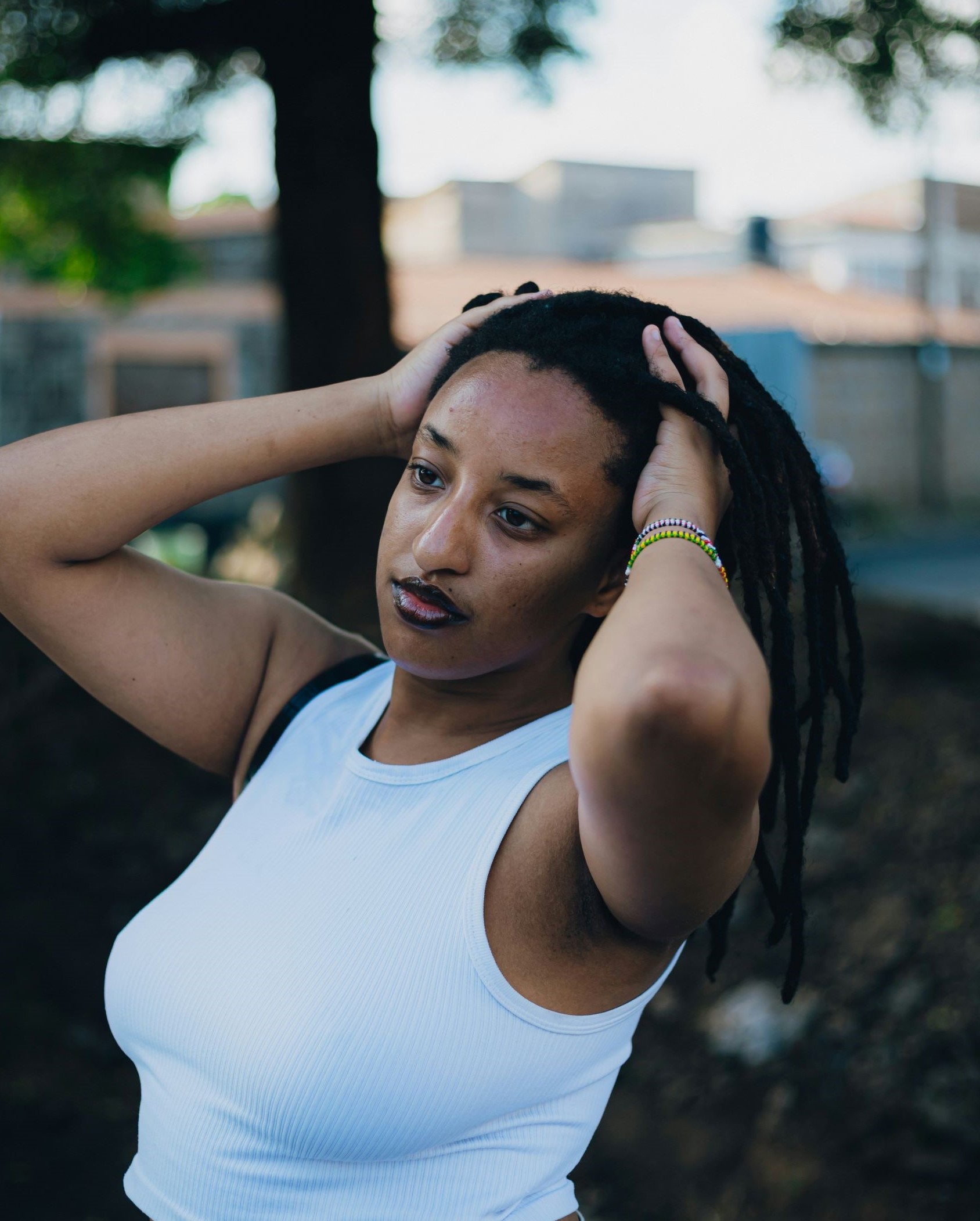 Woman thinking calmly about life, using tips and tricks while exploring new passions to reignite her sense of purpose, with Building Meaning in Life initiatives.