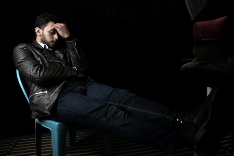 Man reflecting before resorting to pills for erectile dysfunction and deeper causes, due to Underlying Erection Problems.