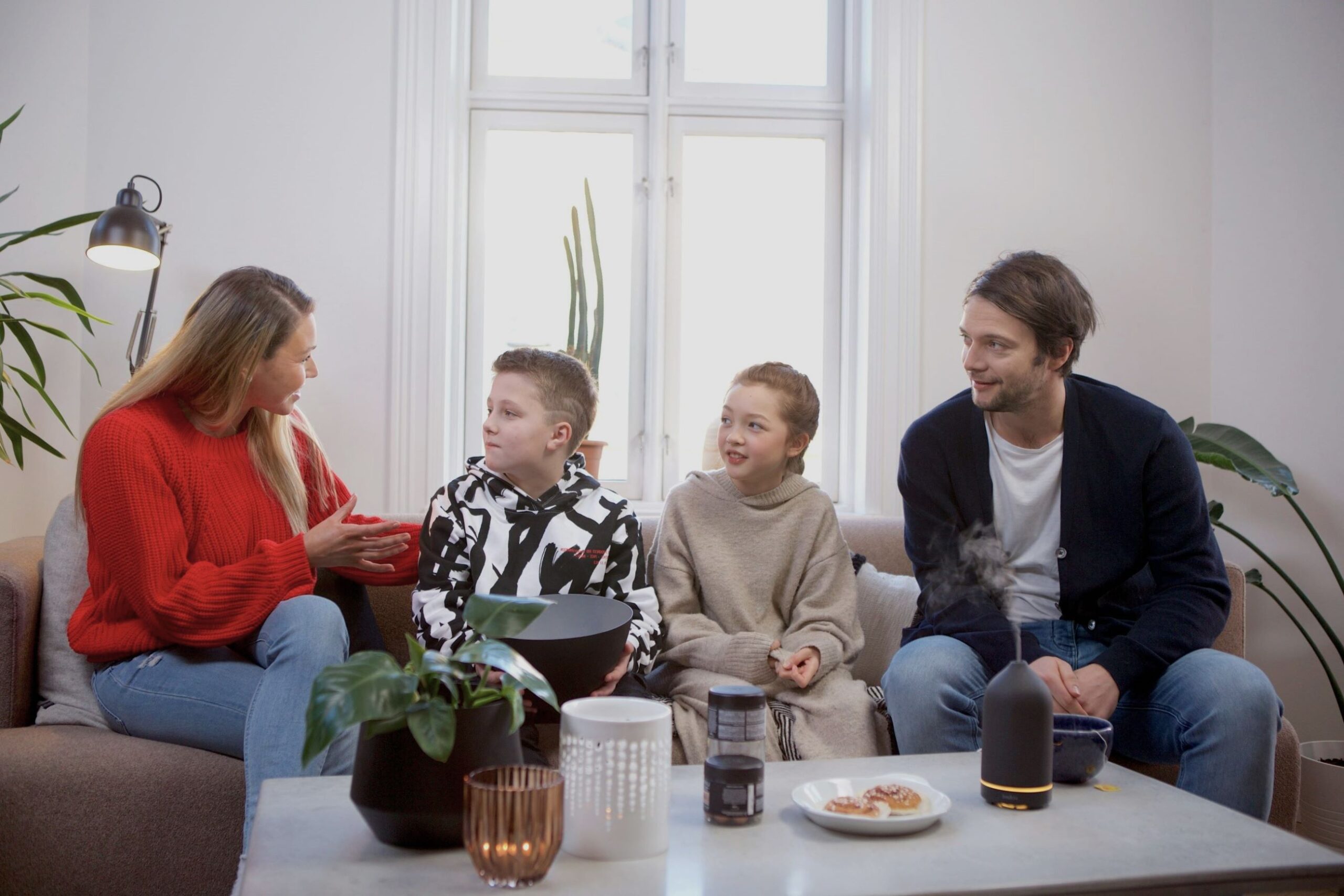 Separated parents calmly discussing their children, showing a happy family through a Joint Parenting Plan.