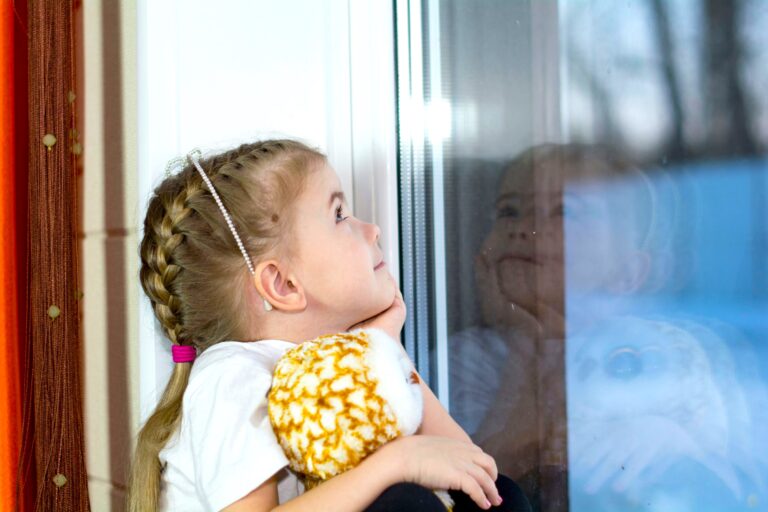 Young girl getting caught up in the situation of her parents getting separated or divorced, looking confused and lacking knowledge of Kids Understanding Separation.