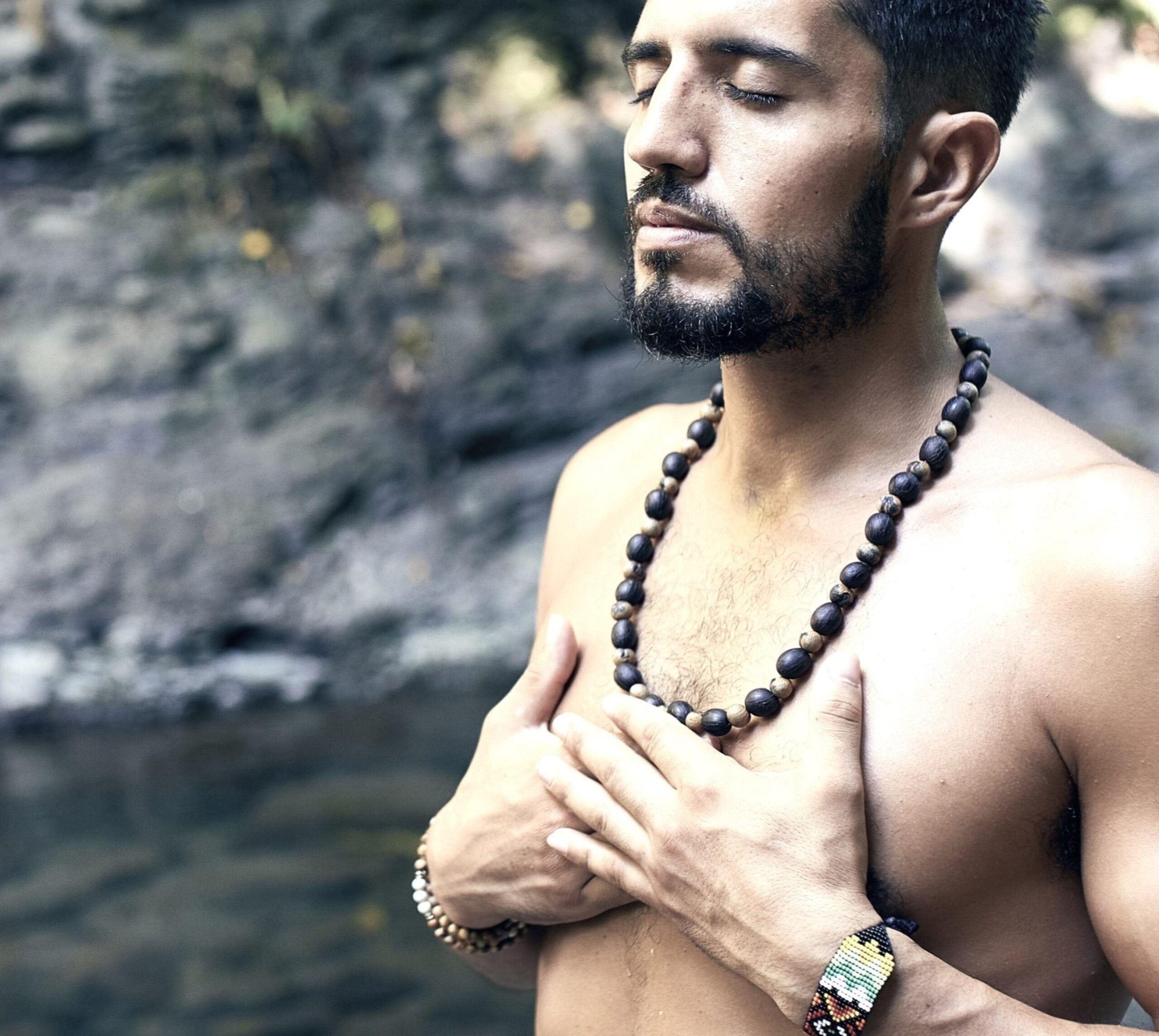 Man doing mindfulness in nature to ease internal noise and feel at peace with Overreactions To Awkward Silence.