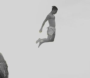 A person jumps from cliffs into the sea, symbolising courage, freedom, and Techniques To Stop FOMO in daily life.