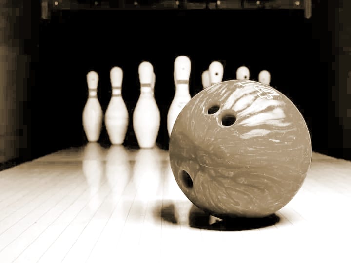 Bowling ball facing pins, symbolising challenges, Doubt and Difficulty when supporting relatives with mental illness healing.