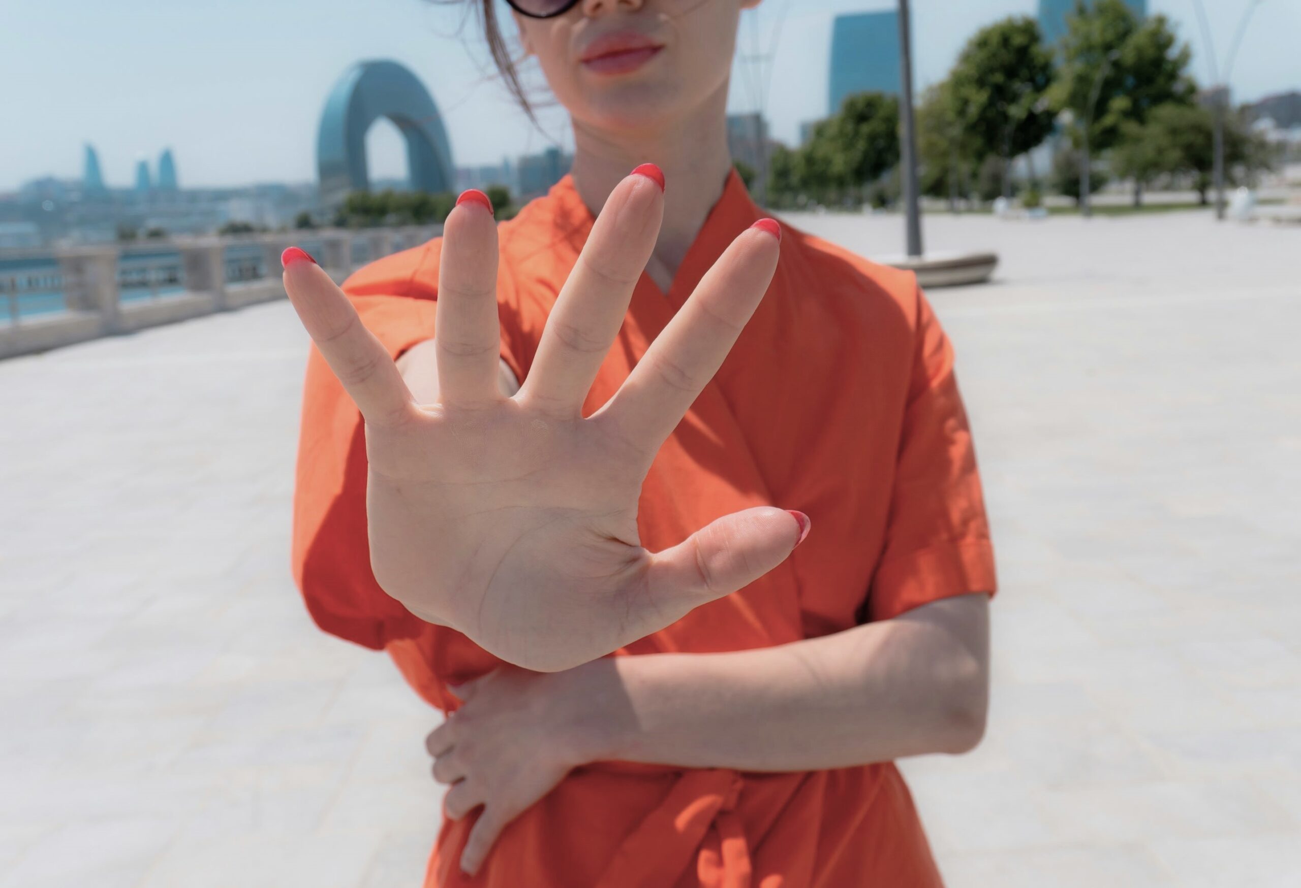 A woman asserting emotional space post-infidelity, reflecting boundary-setting and Taking Responsibility For Infidelity.