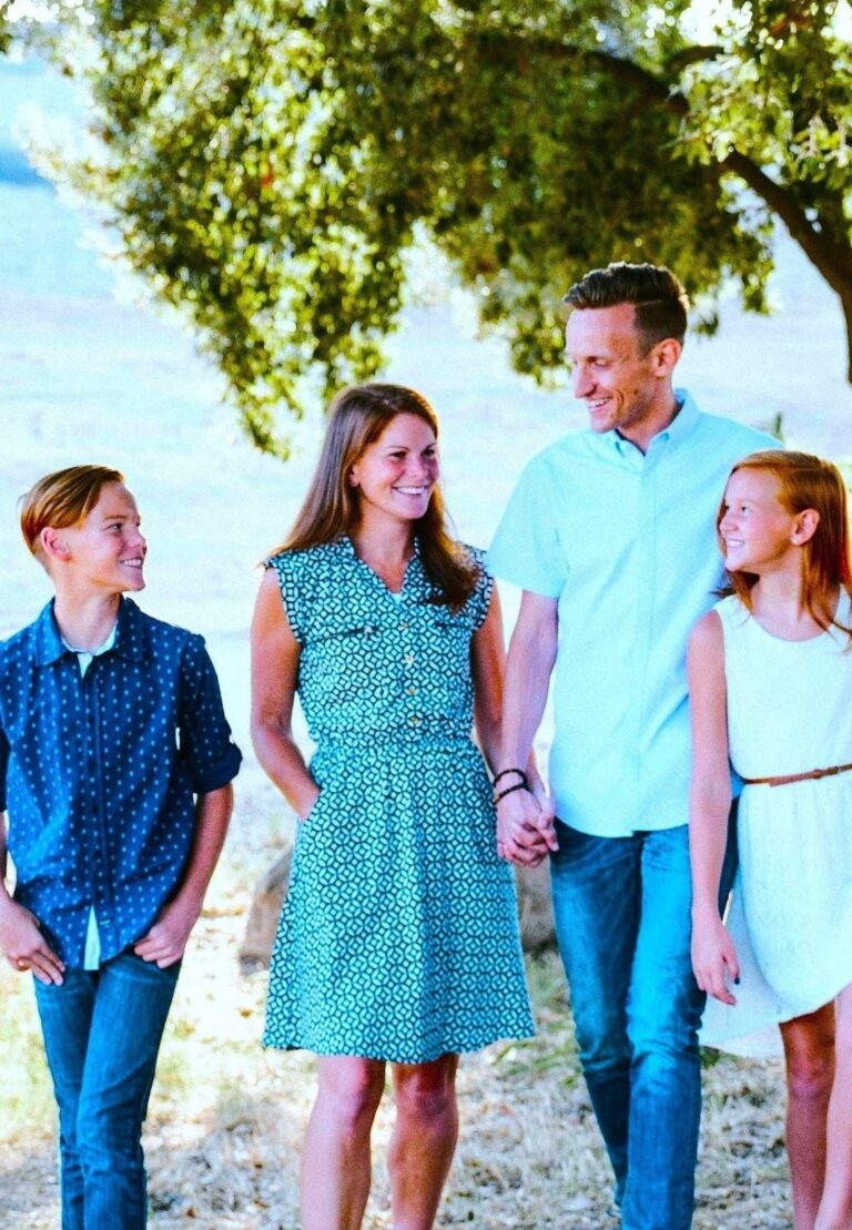 Family walking together outdoors, reflecting how Optimising Openness In Therapy reshapes narratives and builds healthier relationships.