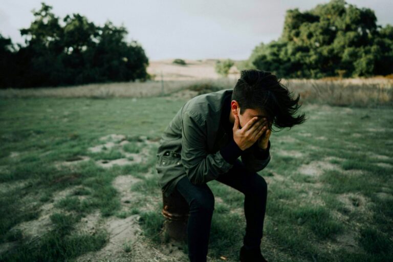 A man feeling emotionally distressed, as day-to-day life feels emotionally different following Death Bereavement.