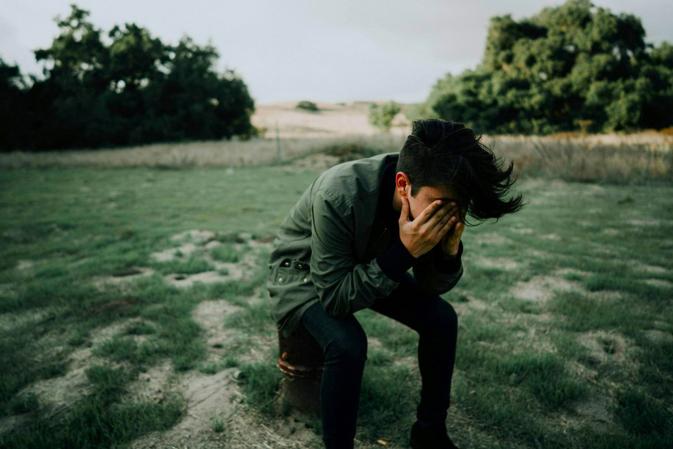A man feeling emotionally distressed, as day-to-day life feels emotionally different following Death Bereavement.