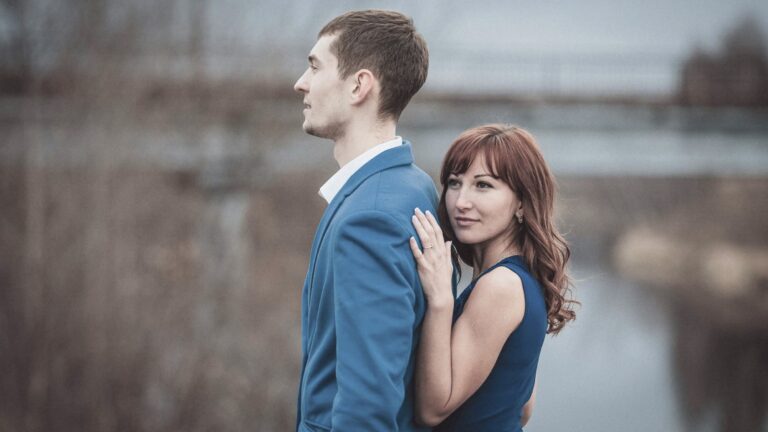 A couple embracing through emotional ups and downs within the circle of life, while Weathering Relationship Difficulties