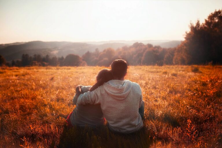 Couple spending time together in quiet nature space during tough moments to cool off as they're Navigating Rocky Life Moments.