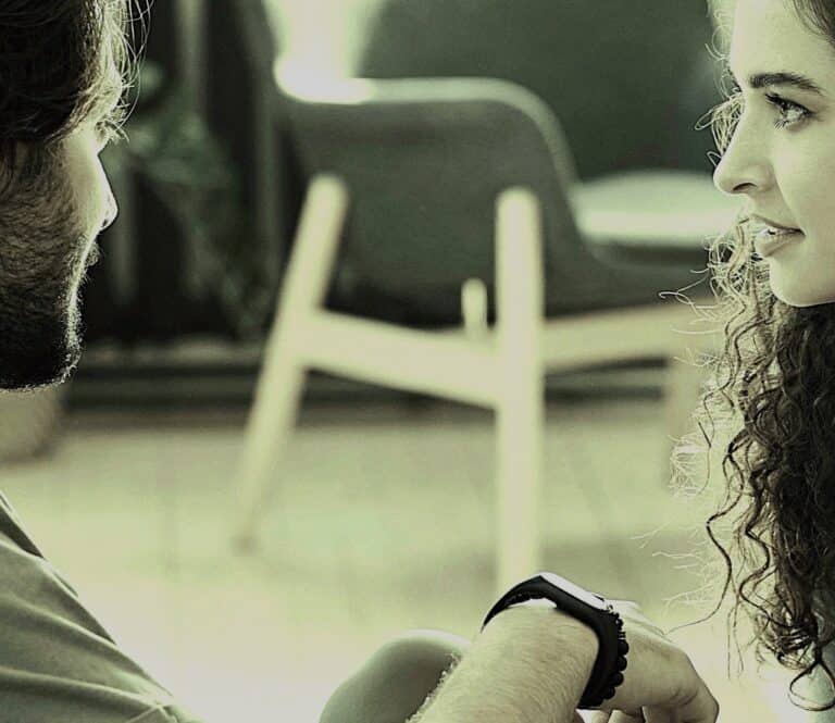 Supportive conversation between a mental health professional and a client, highlighting the importance of empathetic listening in therapeutic settings. Focus on trust, communication, and emotional support in mental health care.