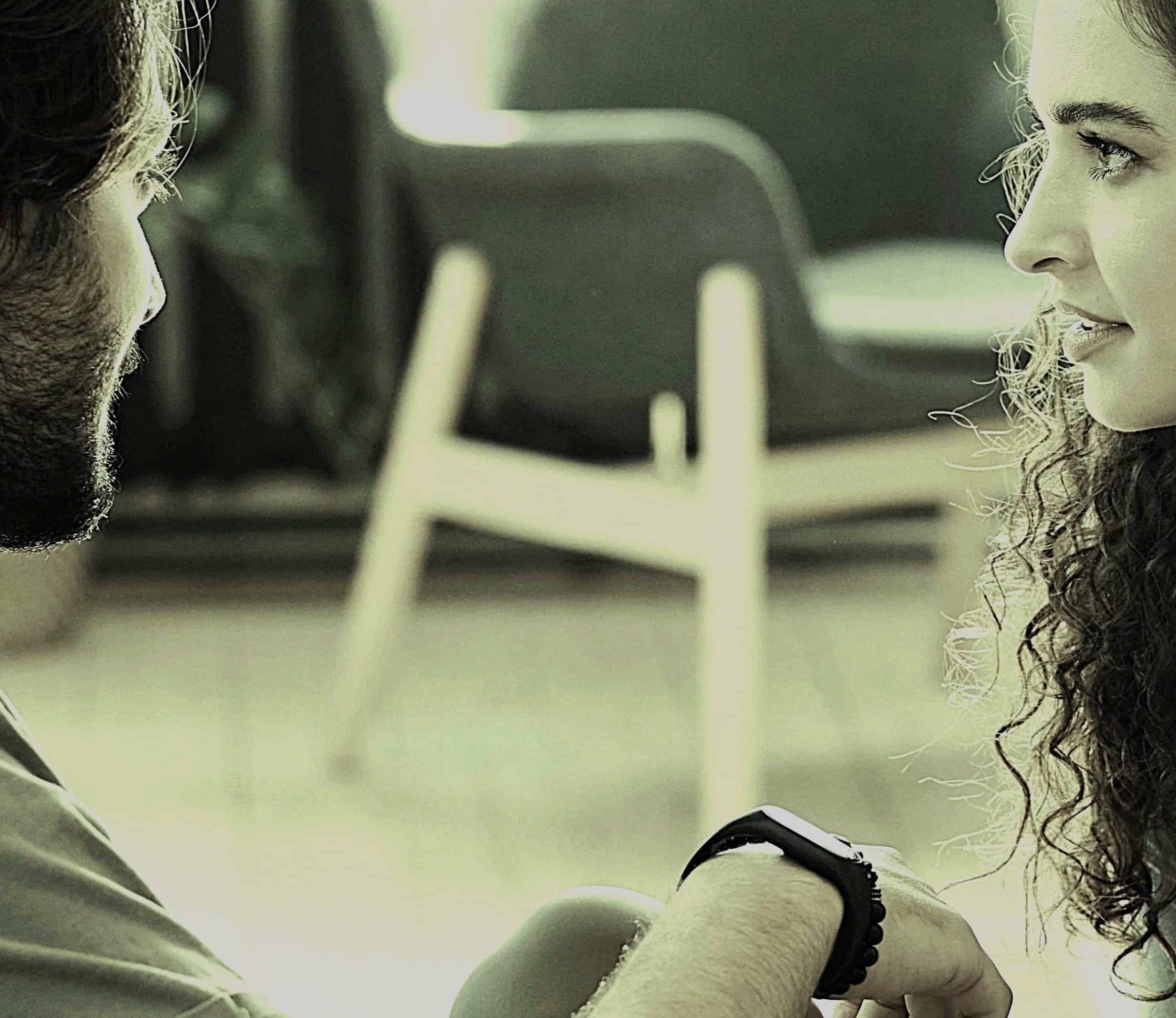 Supportive conversation between a mental health professional and a client, highlighting the importance of empathetic listening in therapeutic settings. Focus on trust, communication, and emotional support in mental health care.