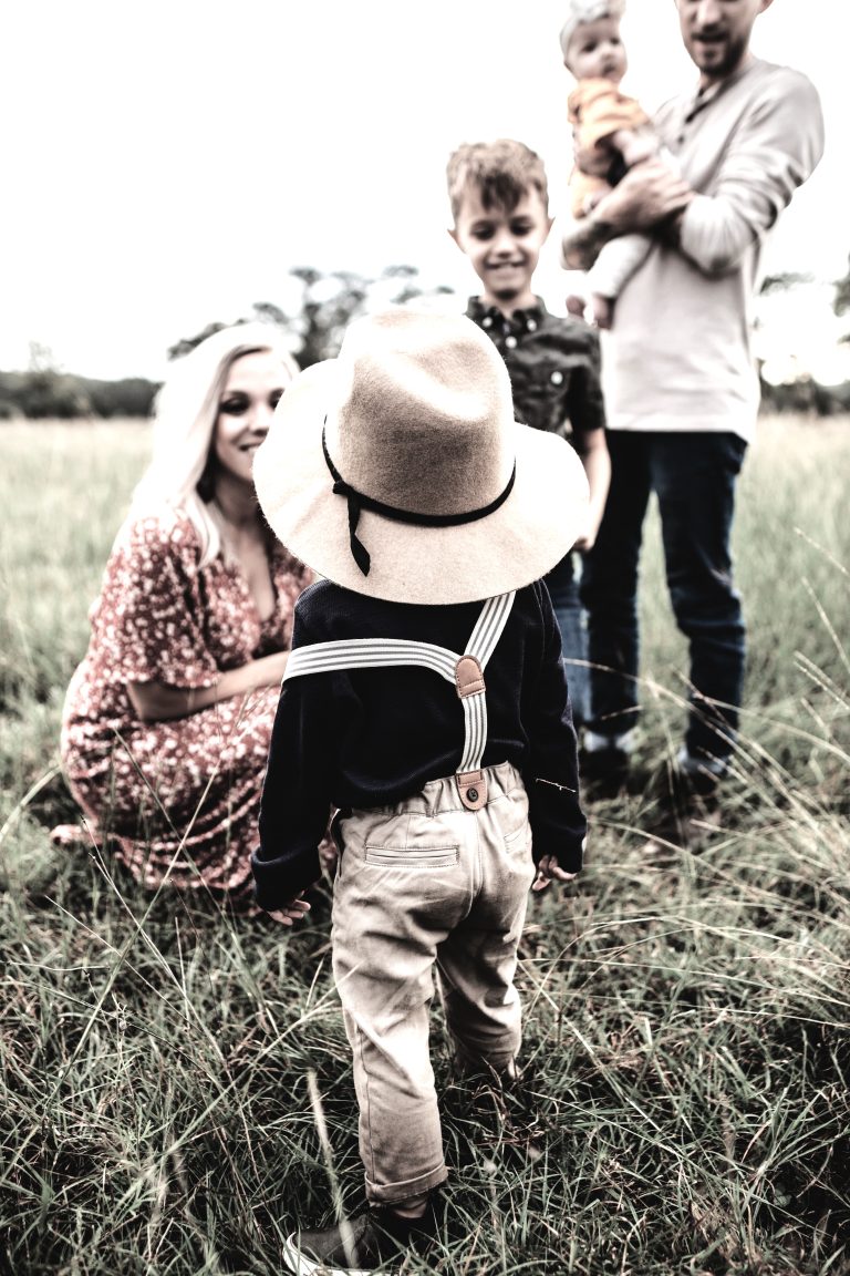 Family sharing warm outdoor time shows care and bonds from family attachment.