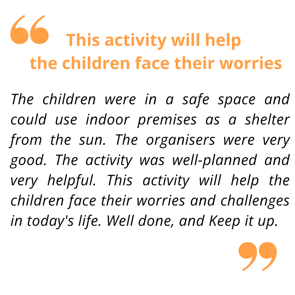 Children sitting in a circle outdoors during a therapeutic activity, engaging in a counselling session or group therapy in a supportive environment.