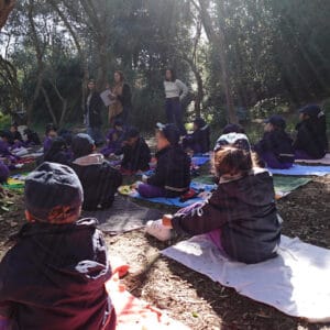 Grounding activity outdoors for children to promote mindfulness and emotional well-being.