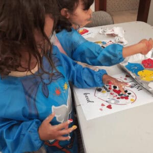 Creative activity for children with mental health challenges, involving finger painting and self-expression. Therapeutic and engaging art project to promote emotional well-being.