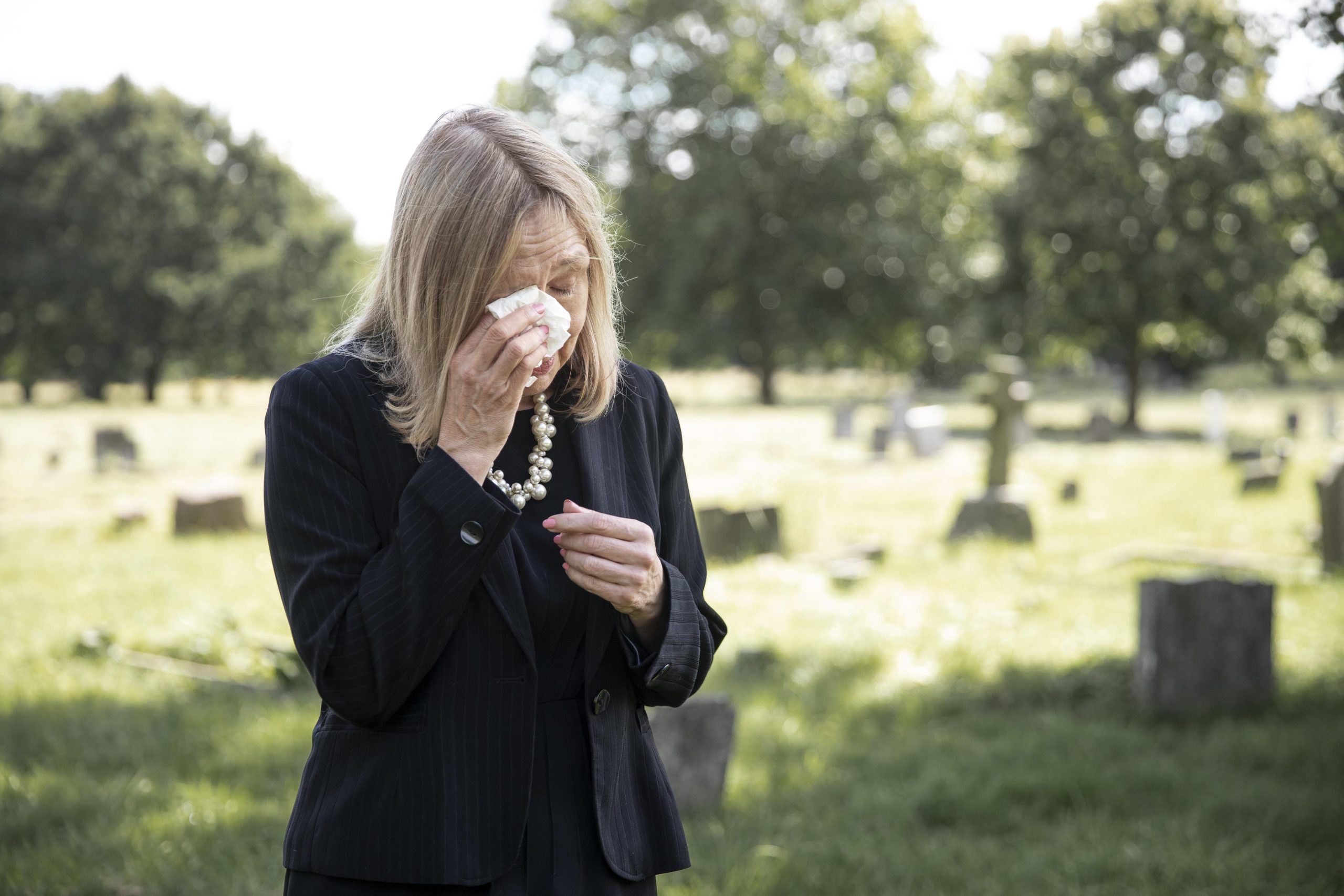 woman crying at a funeral