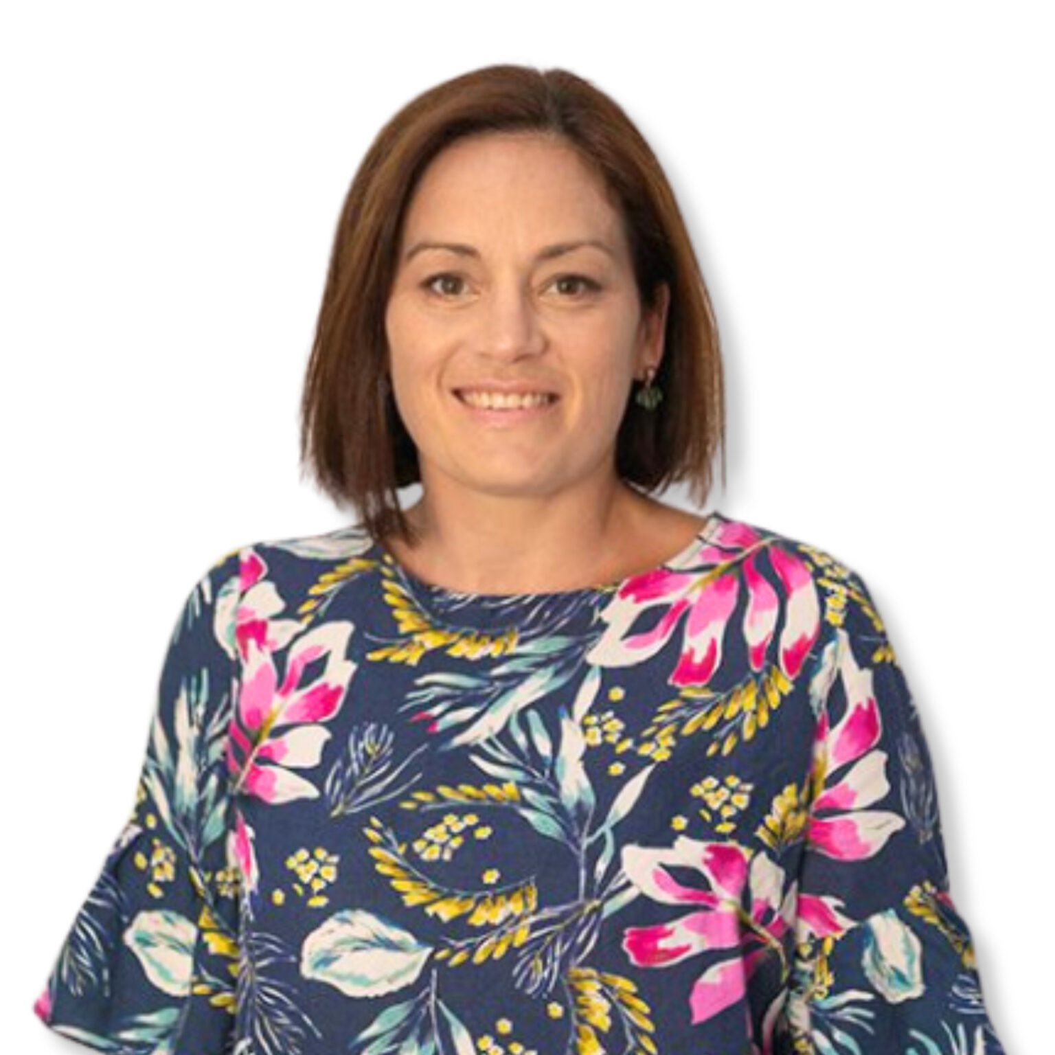 Calm woman with shoulder-length brown hair smiling, wearing a colourful floral top, against a plain white background - conveying positivity and approachability in mental health imagery.
