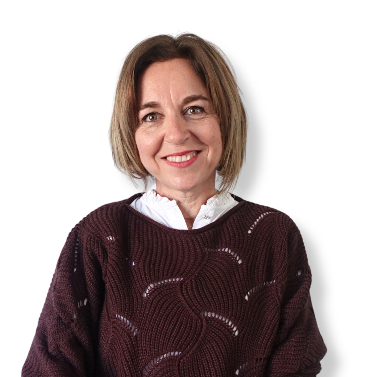 Calm, professional woman smiling, representing mental health and well-being, looking approachable and empathetic in a counselling or therapy setting.
