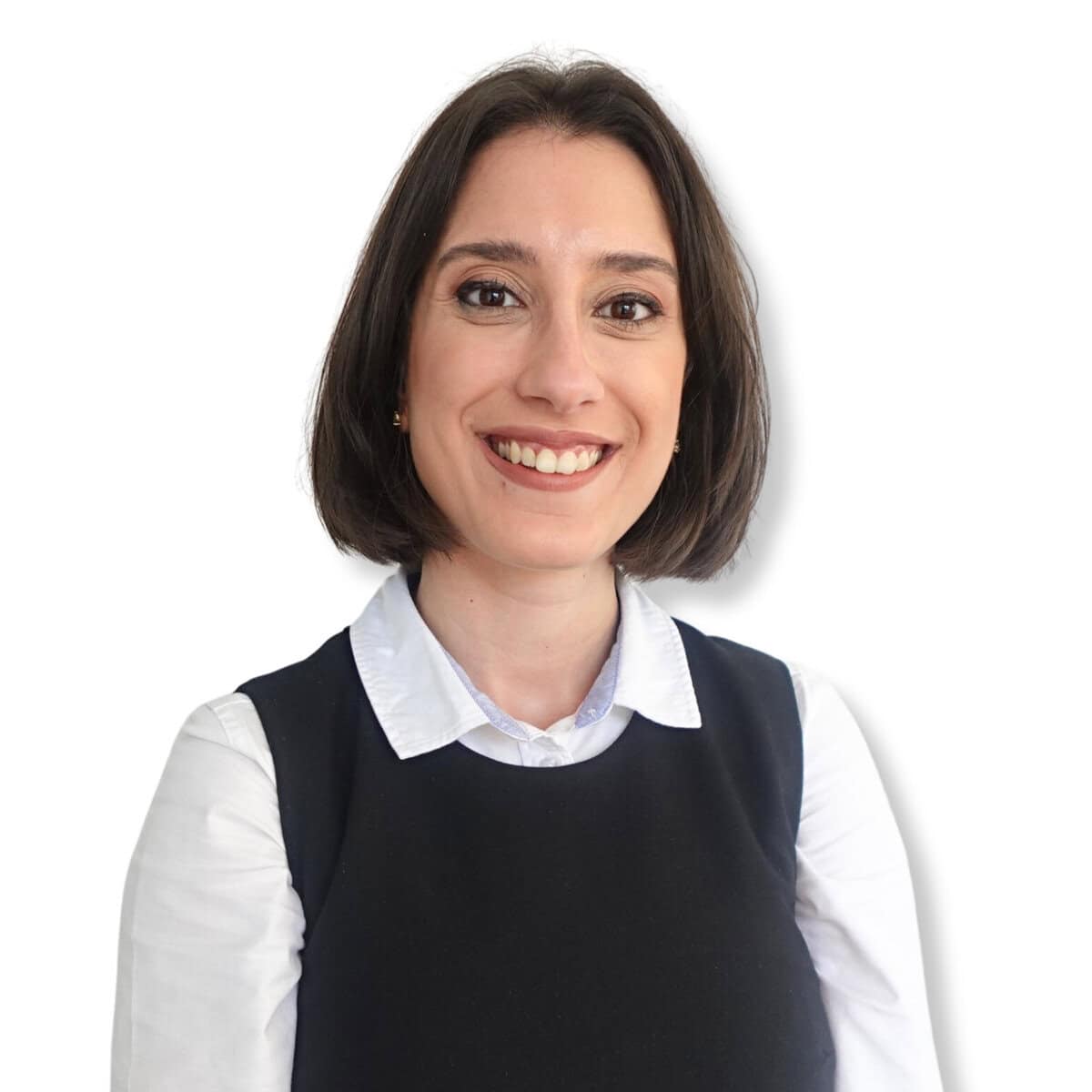 Smiling woman in professional attire, representing mental health support and counselling services.