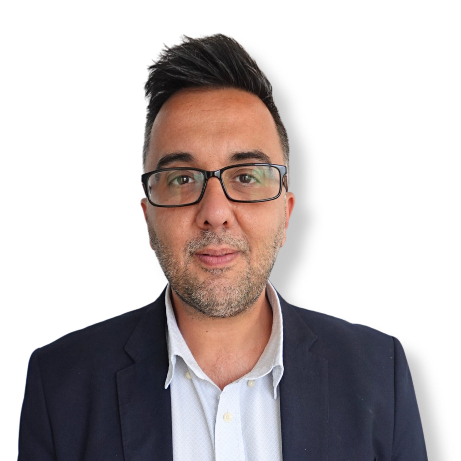 Calm professional man wearing glasses, dressed in a suit and white shirt, expressing confidence and approachability in a mental health or counselling context.