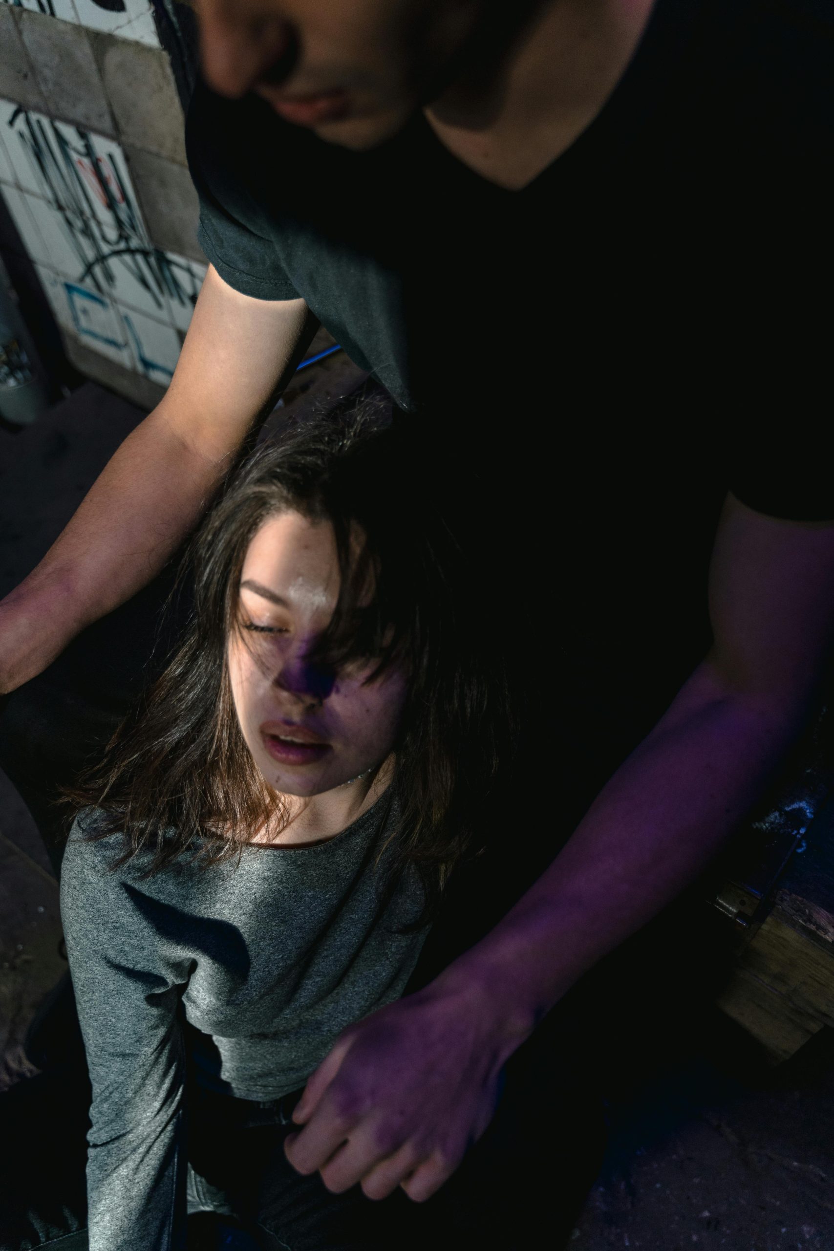 Two individuals can be seen at a festival, the girl looking somewhat dishevelled due to the effects of the festival drugs that she had during the event. Most people do not seem to realise that the risks of festival drugs are much higher than they think.