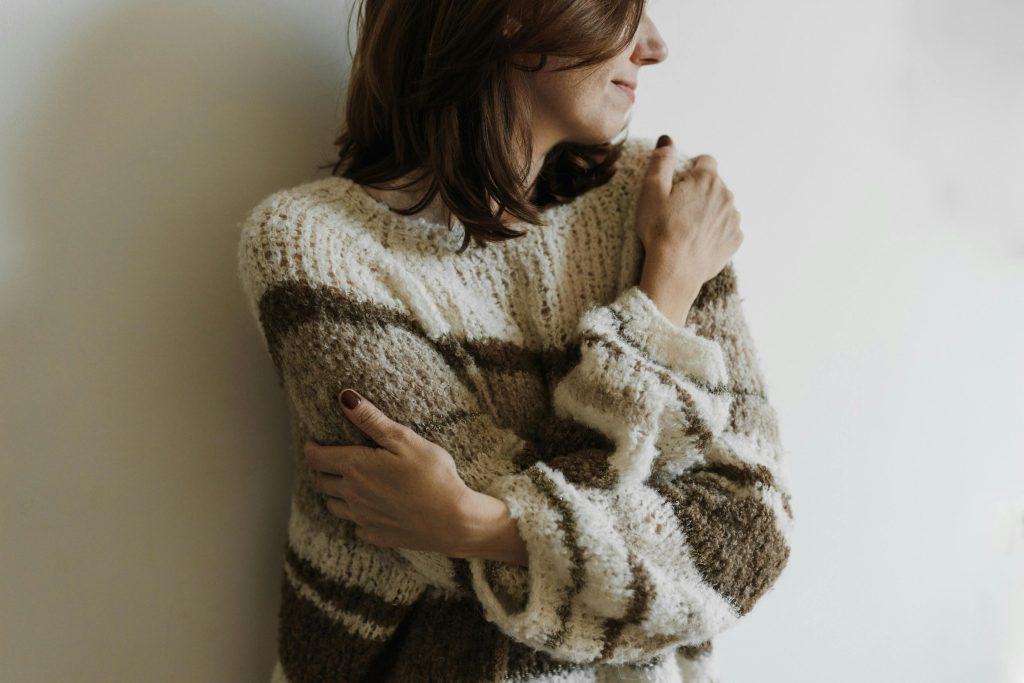 A woman is seen embracing herself for what she is, shaping her love life more positively.