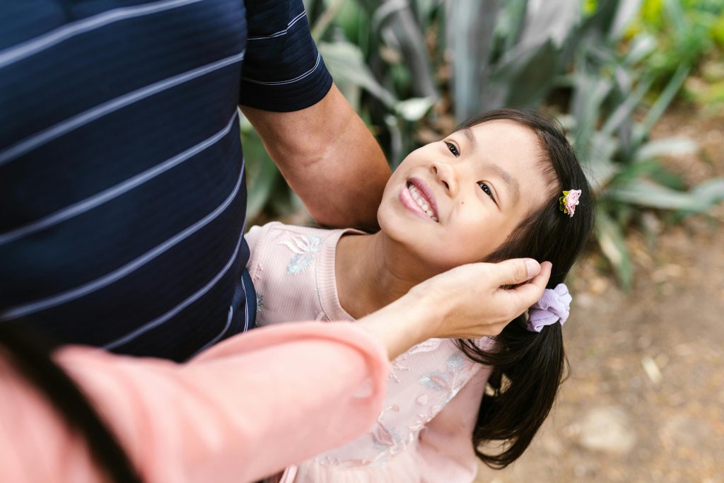 A man and his wife are seen spending time with their young daughter, trying to her improve her concentration as a person with ADHD.