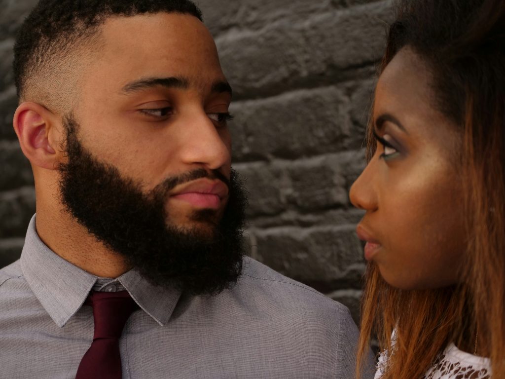 Here we can see a man looking at his partner, presumably feeling ashamed of the fact he's not feeling butterflies for his partner like he used to. Despite this, it's actually a normal thing to happen.