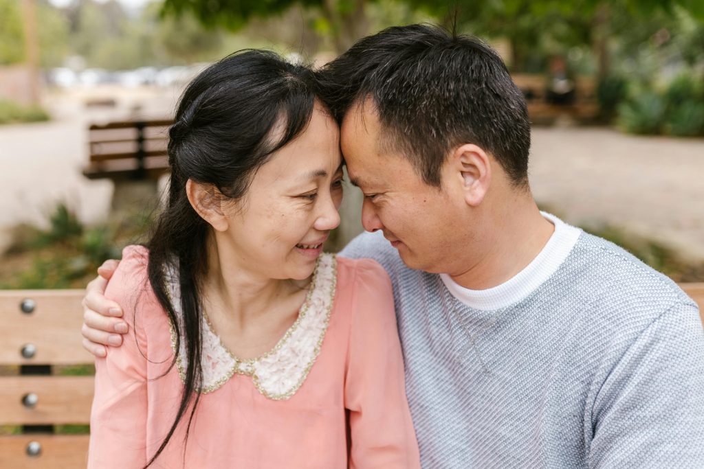 A couple can be seen hugging each other romantically, embracing one another for what they are. Sometimes, one of the partners in the couple (or maybe even both) are autistic, so sometimes, understanding autistic partners can really help in the long run.