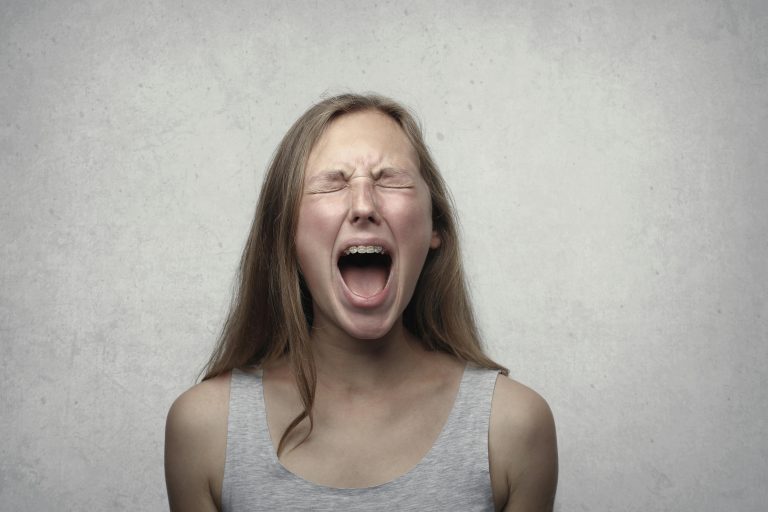 Teen expressing anger after conflict using steps to control emotions.