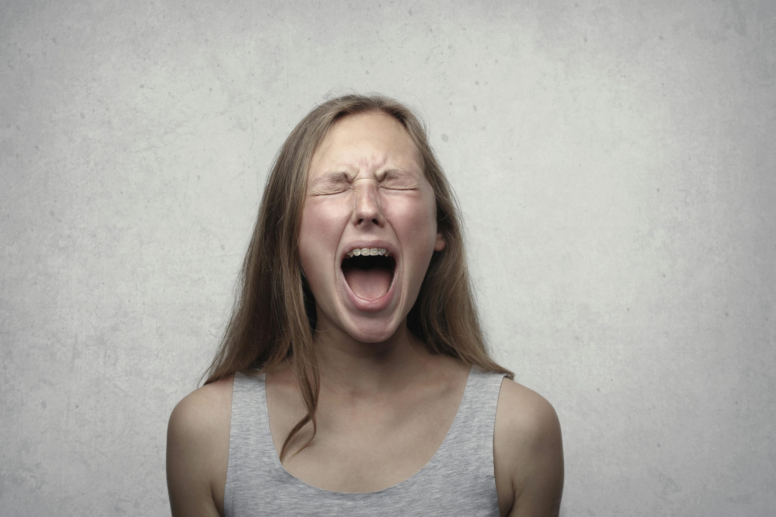 Teen expressing anger after conflict using steps to control emotions.