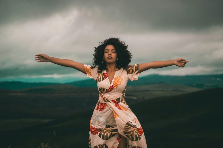 Woman practicing how to feel your feelings with mindful presence outdoors.