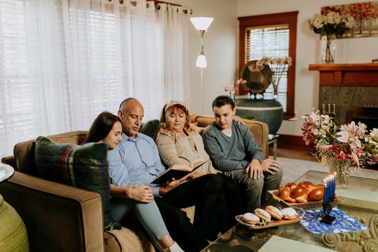 Heritage preservation shown as a family bonds over Hanukkah, supporting connection and wellbeing at home.