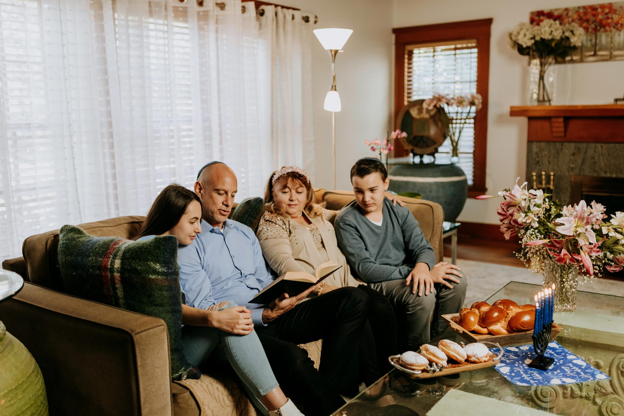 Heritage preservation shown as a family bonds over Hanukkah, supporting connection and wellbeing at home.