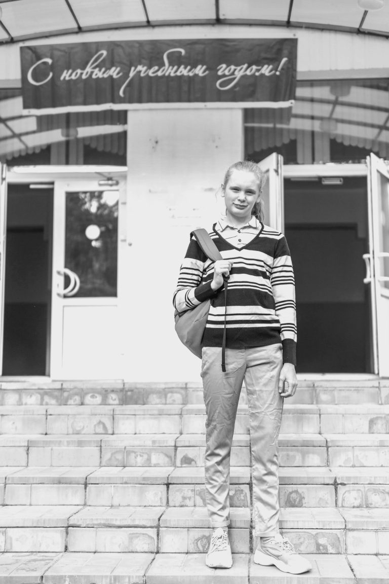 Emotional readiness reflected in a child calmly returning to school, showing support after summer break.