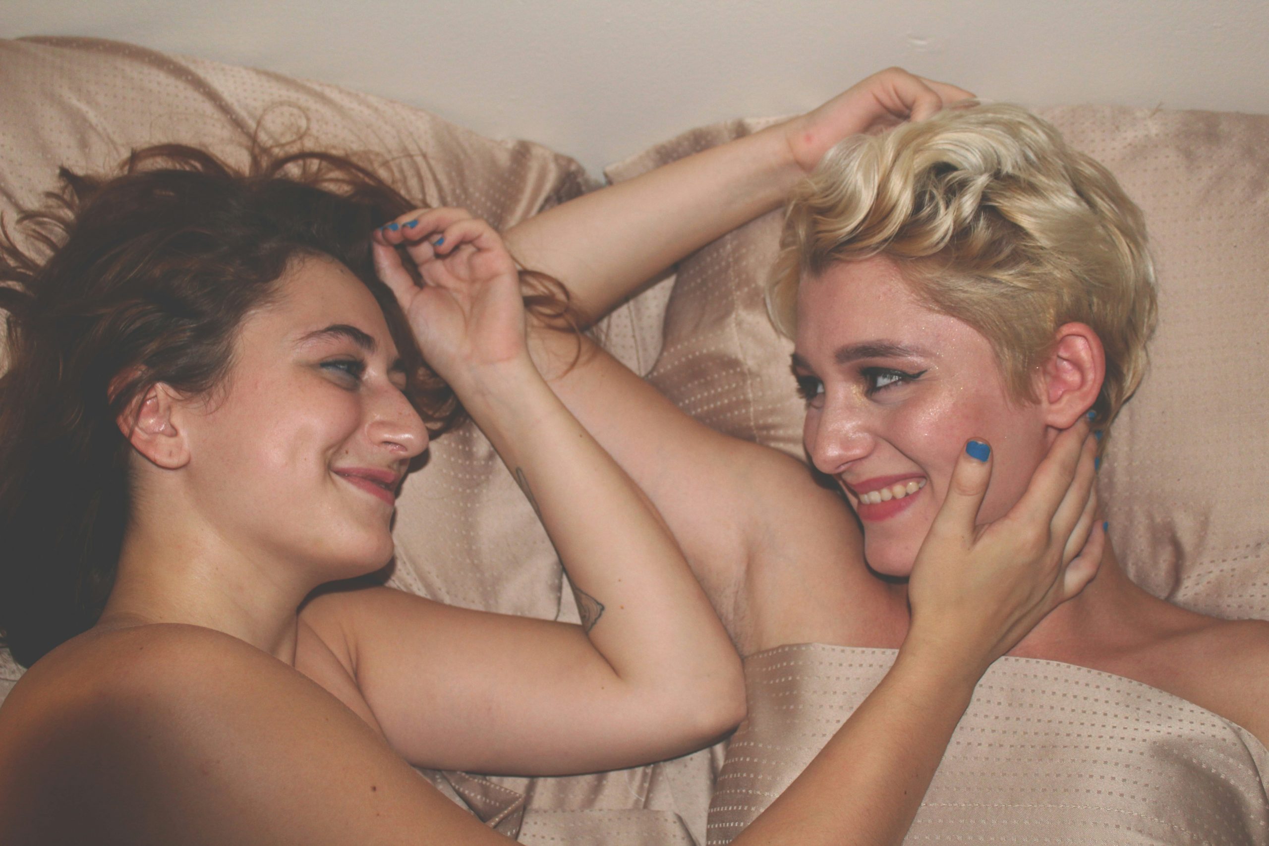 Shame healing shown in two partners connecting in bed, capturing intimacy and support to ease bedroom anxiety.