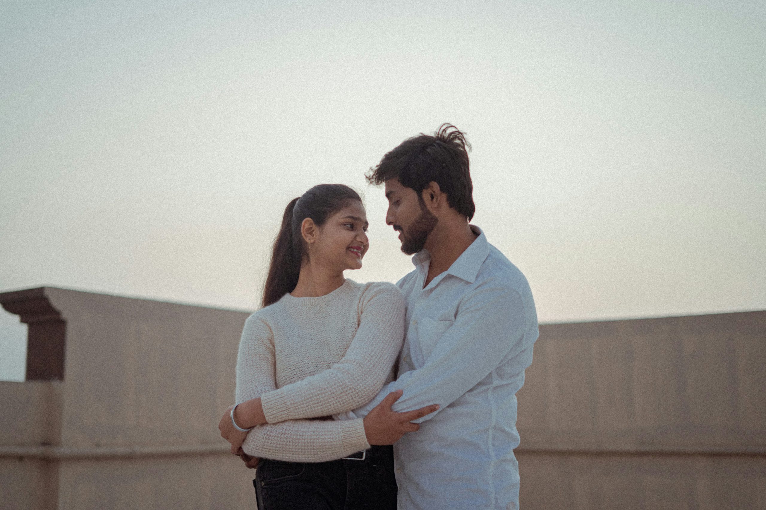 Sex discussion shown through a caring couple embracing, reflecting trust, connection, and emotional openness.
