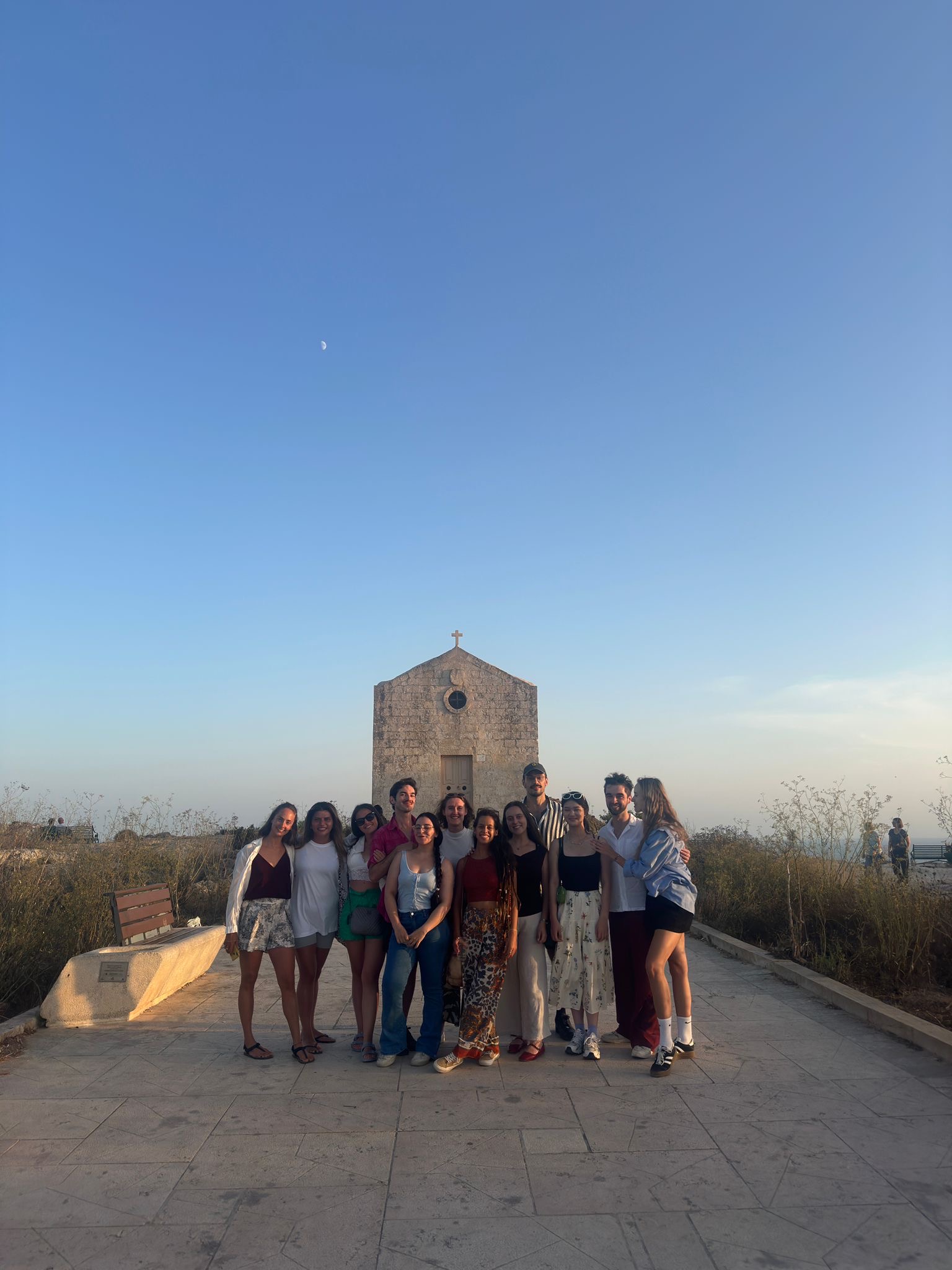 Group of interns posing together in Malta, representing teamwork, cultural exchange, and Zsófia Viga Internship Review.