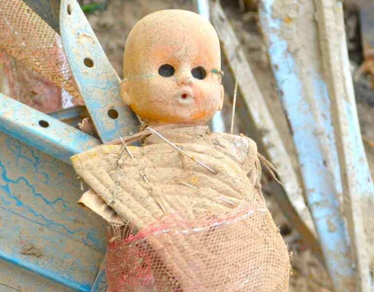 Image of a damaged doll symbolising childhood trauma and unhealthy attachments, reflecting Overcoming Dependency Issues in adulthood.