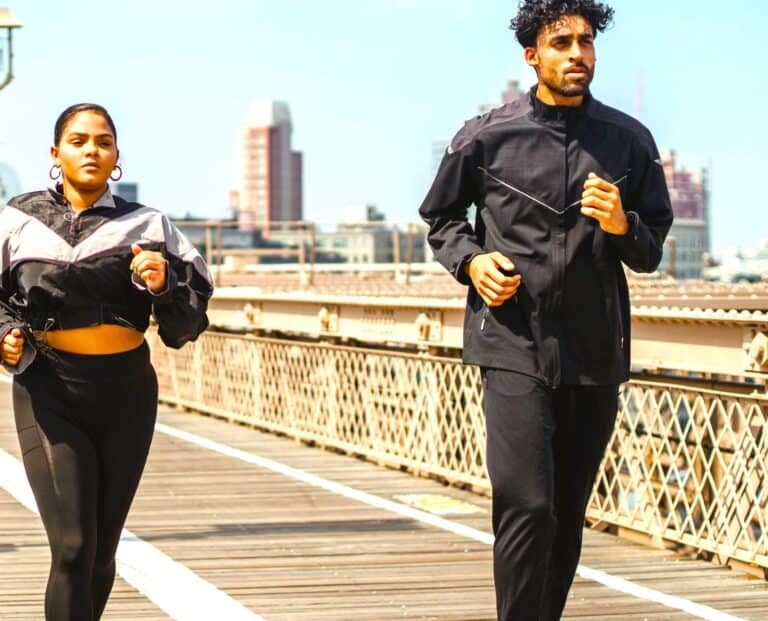 Couple jogging together representing Physical Partnership Satisfaction through daily exercise and teamwork improving relationship quality.