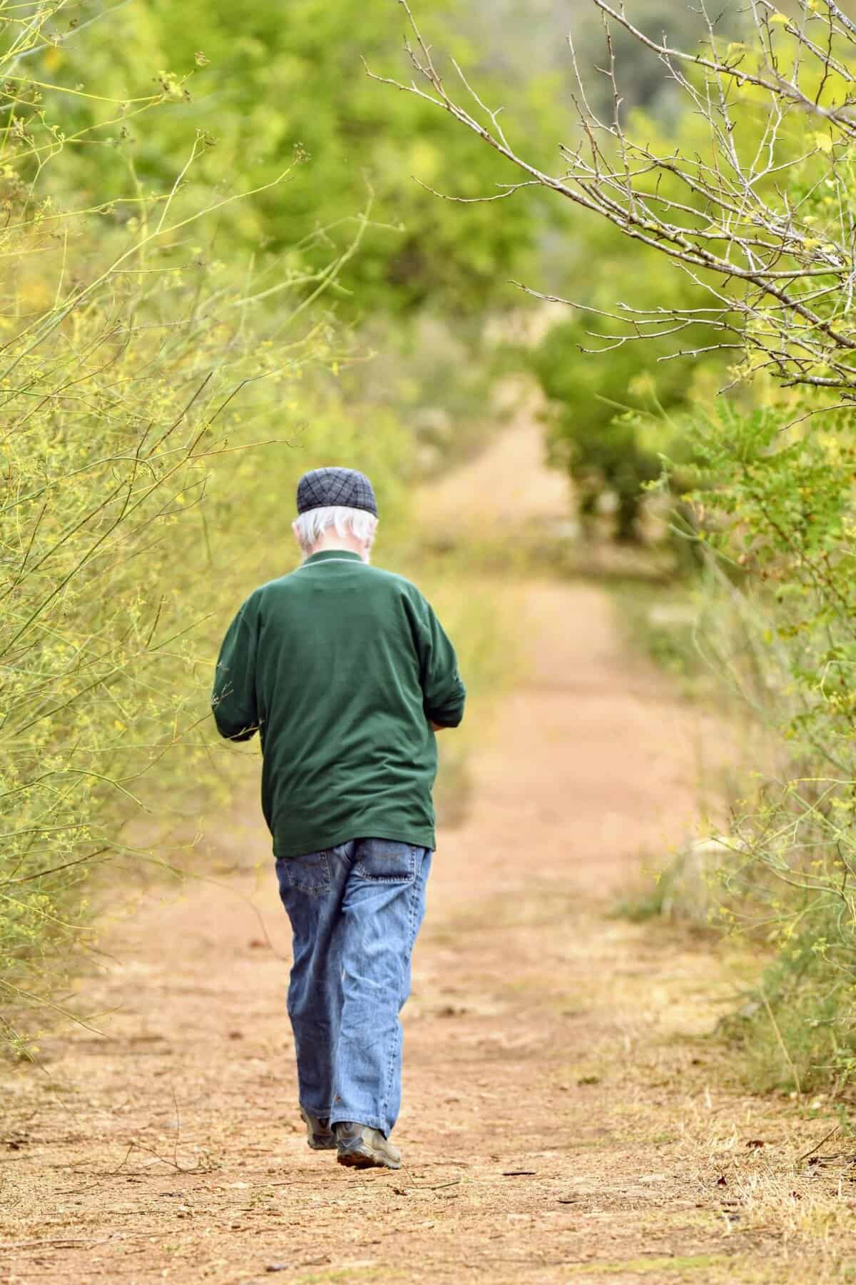 Close-up of an elderly man with teary eyes symbolising Tailored Support Cancer Journey during his cancer struggle.