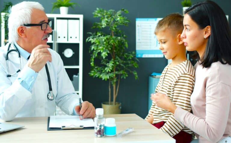 A doctor advises a divorced parent and child on family wellness, supporting Redesigning Holidays After Separation.