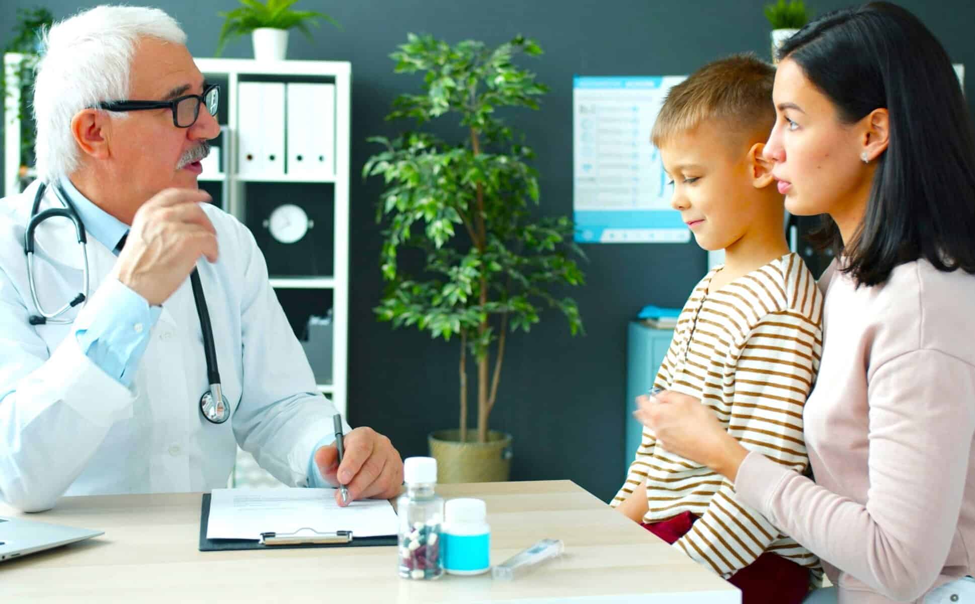 A doctor advises a divorced parent and child on family wellness, supporting Redesigning Holidays After Separation.