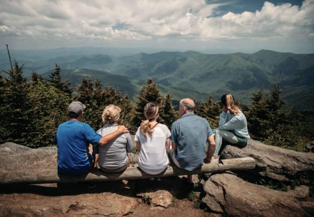 Family overlooking mountains, showing connection, structure, and emotional unity through Family Inclusion.