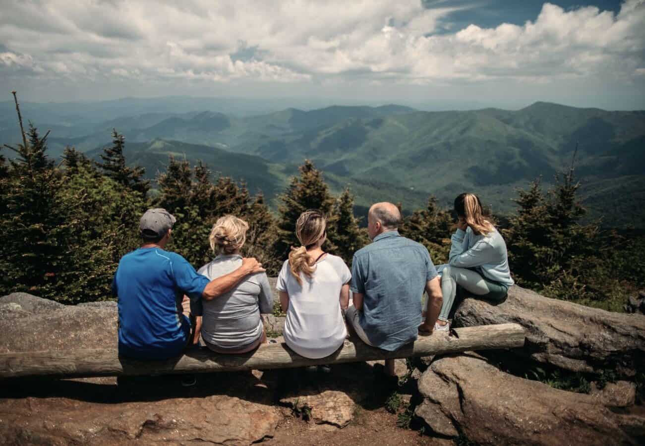 Family overlooking mountains, showing connection, structure, and emotional unity through Family Inclusion.