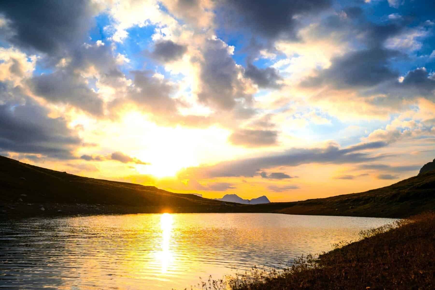 Quiet sunrise over still water, symbolizing reflection, simplicity, and inner clarity Beyond External Validation.